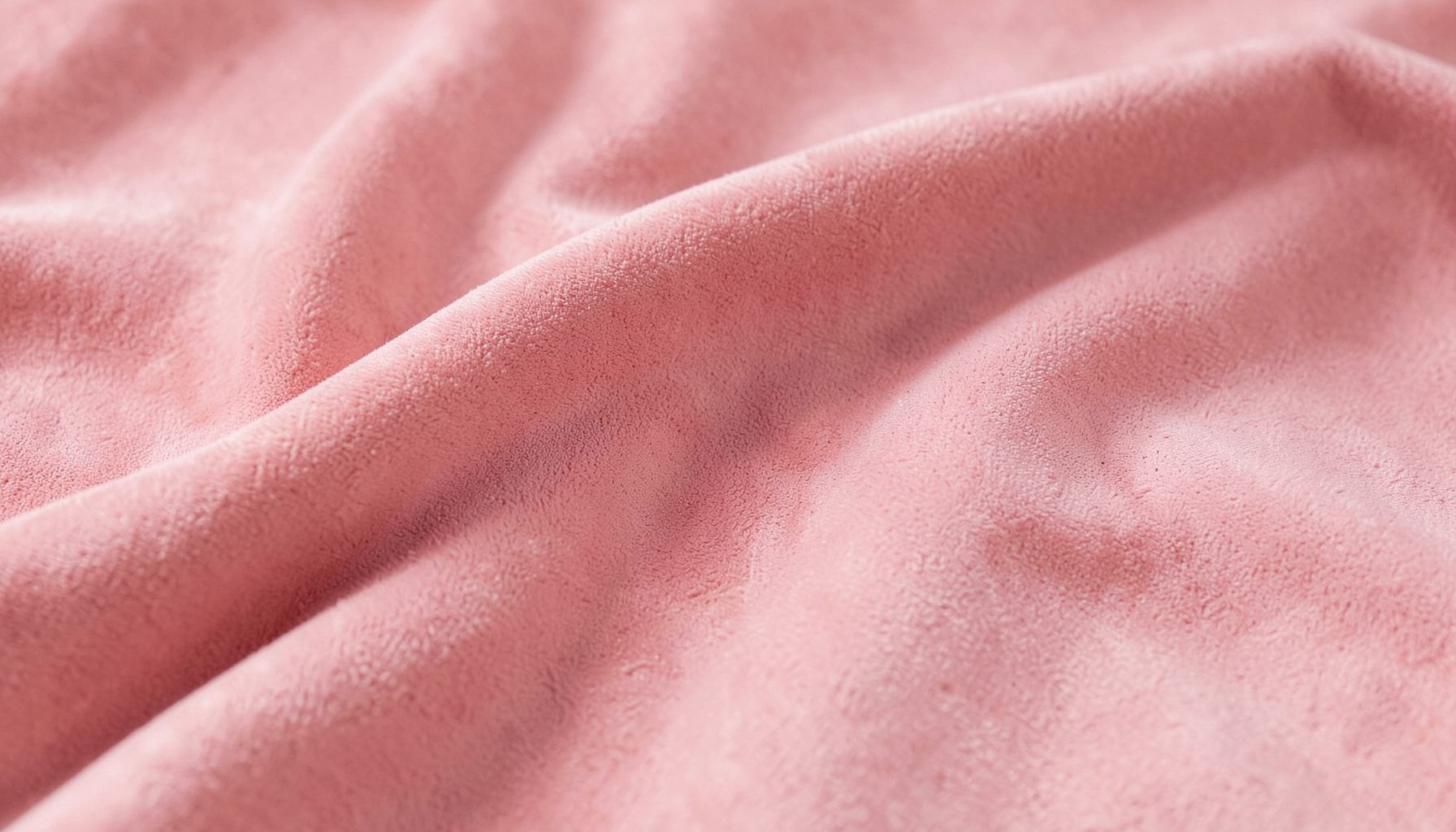 Soft pink suede-like fabric with gentle folds, warm and calm mood