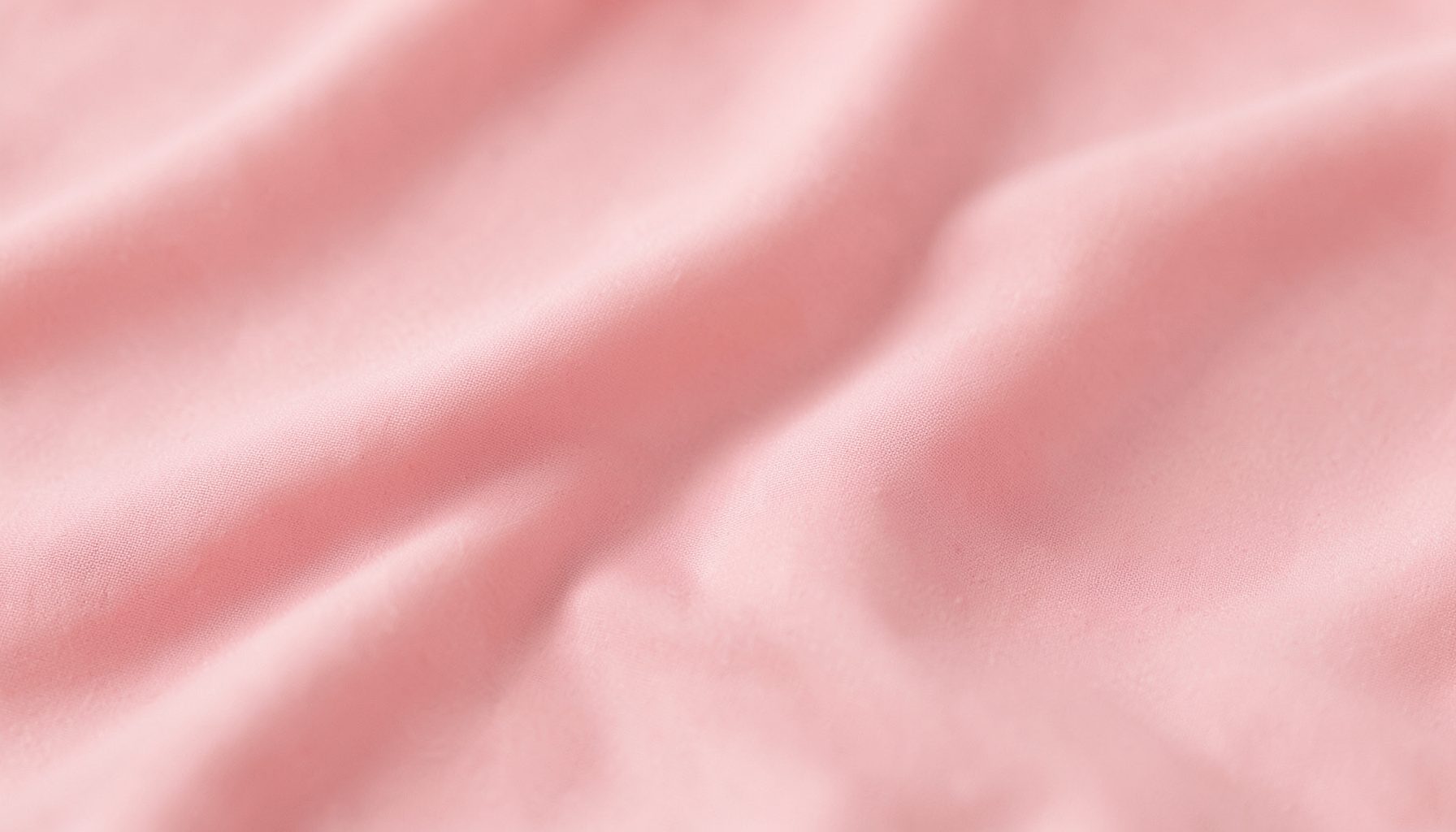Soft pink fabric texture with gentle folds, calm and warm mood