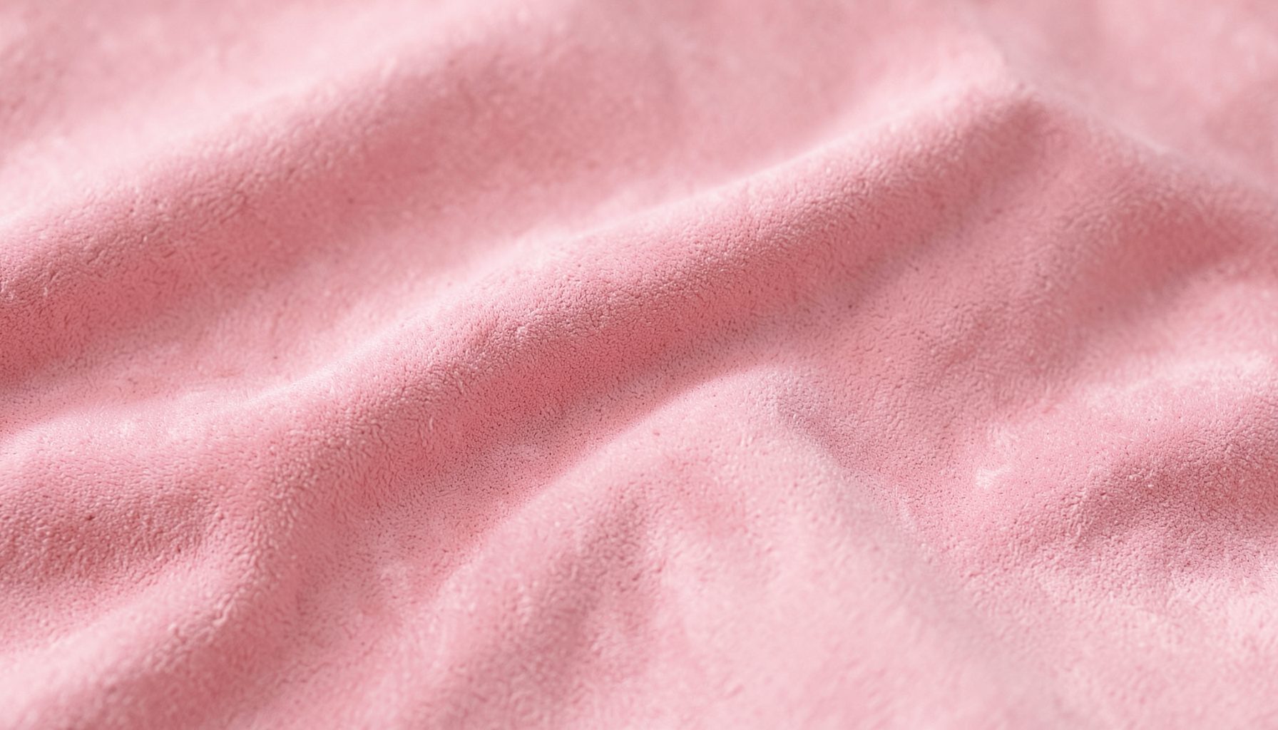 Soft pink suede-like fabric texture, smooth and calm, with gentle folds and a warm, inviting mood