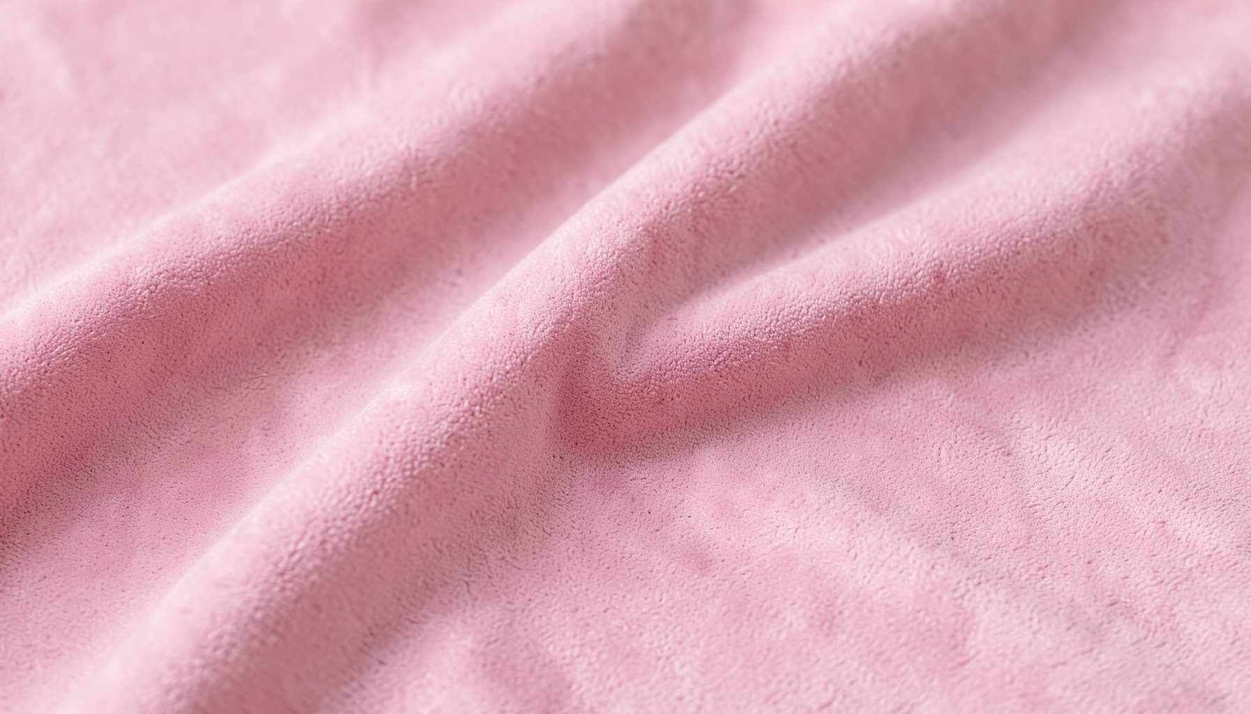 Soft pink suede-like fabric with gentle folds, calm and soothing mood