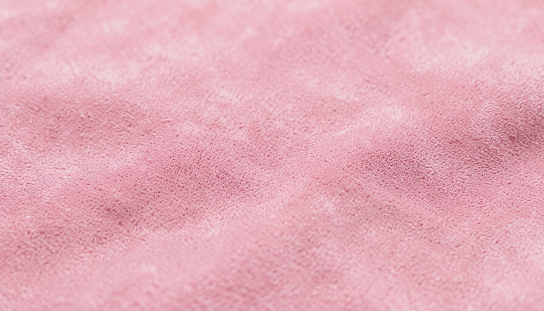 Close-up texture of soft pink suede-like fabric, plain and smooth, calm mood