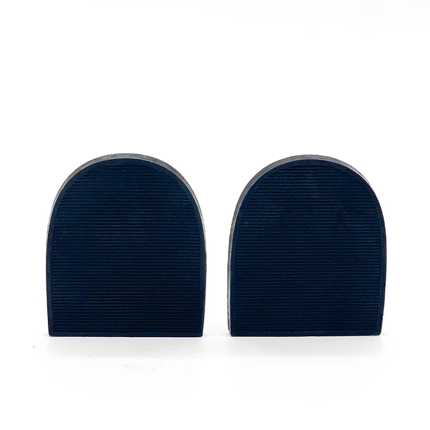 Pair of dark navy rounded rubber heel pads with ridged texture on white background