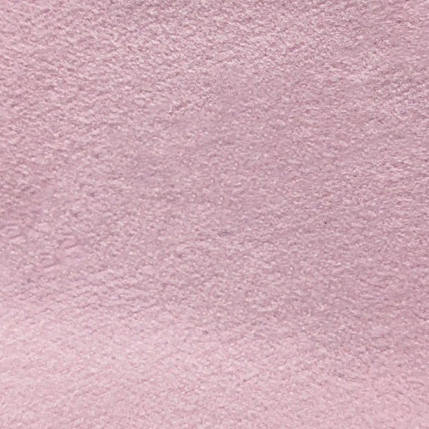 Close-up texture of soft pink suede-like fabric, plain and smooth, in a calm mood, evoking the soft lamb leather used in the Ribbon flats